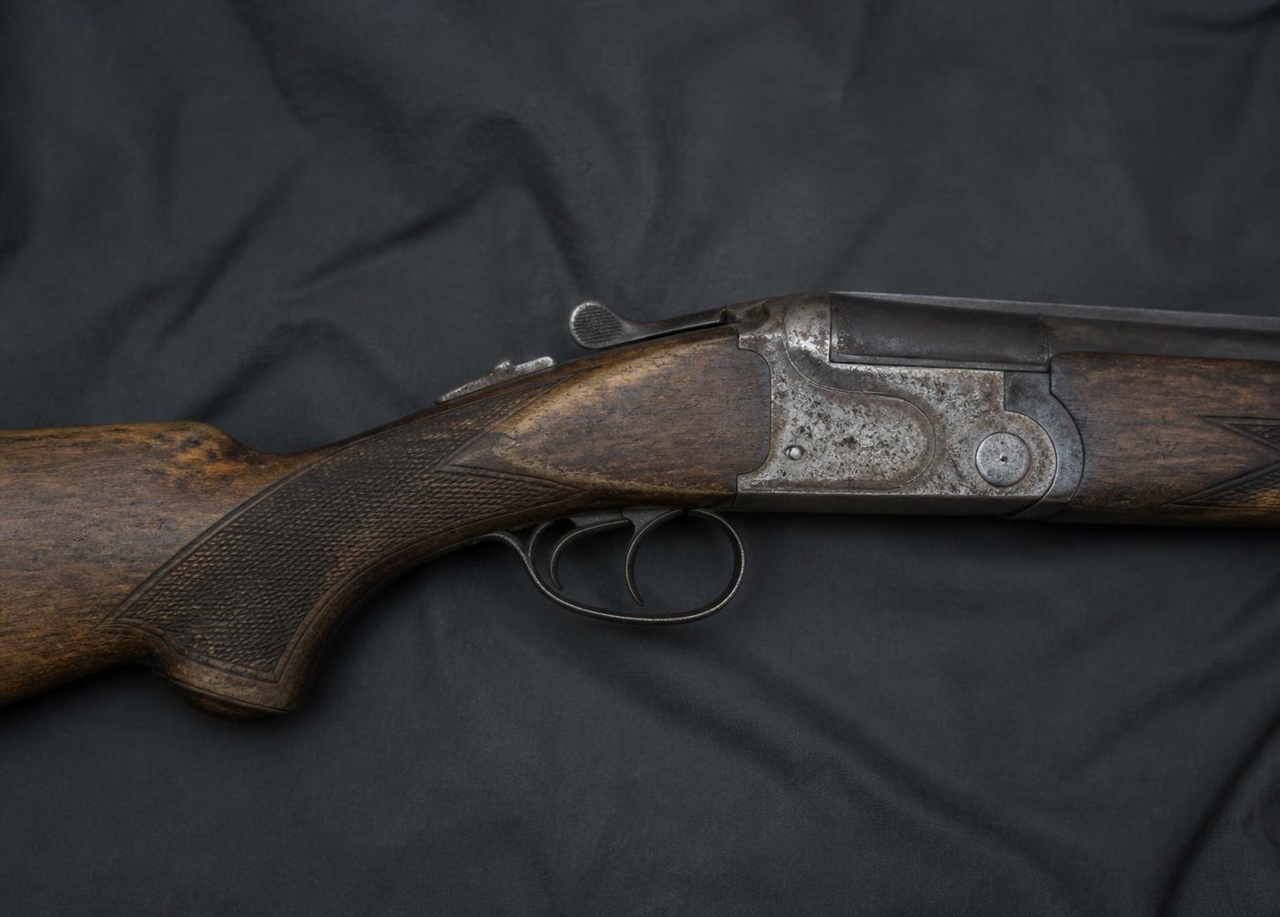Worn vintage shotgun before restoration